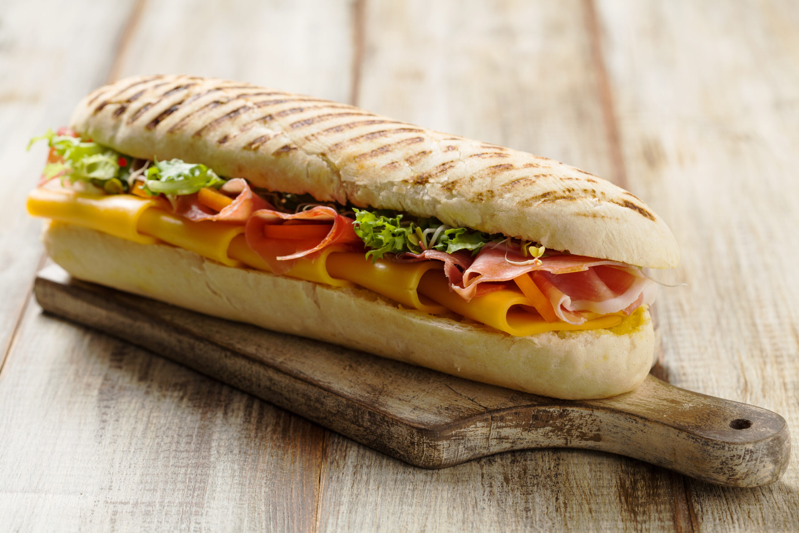 Traditional,Italian,Sandwich,With,Ham,And,Cheese,Served,Warm.
